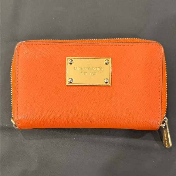 Michael Kors Handbags - Michael Kors Orange Saffiano Zip Wallet with Gold Plaque